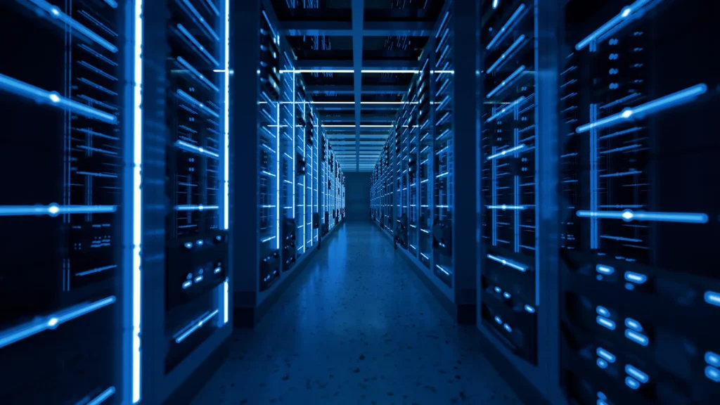 Aisle of illuminated network racks in a data center